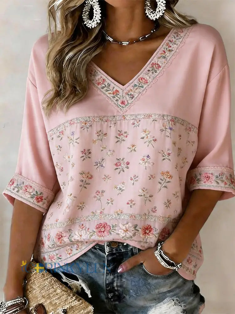 Dams T-shirt i rosa med blommönster halvlånga ärmar och v-ringning - runk / S