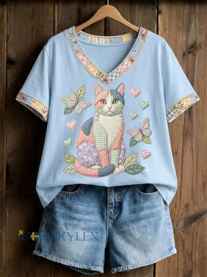 Dams örtblommig kattmönstrad casual t-shirt med V-ringning - ljusblå färg / S