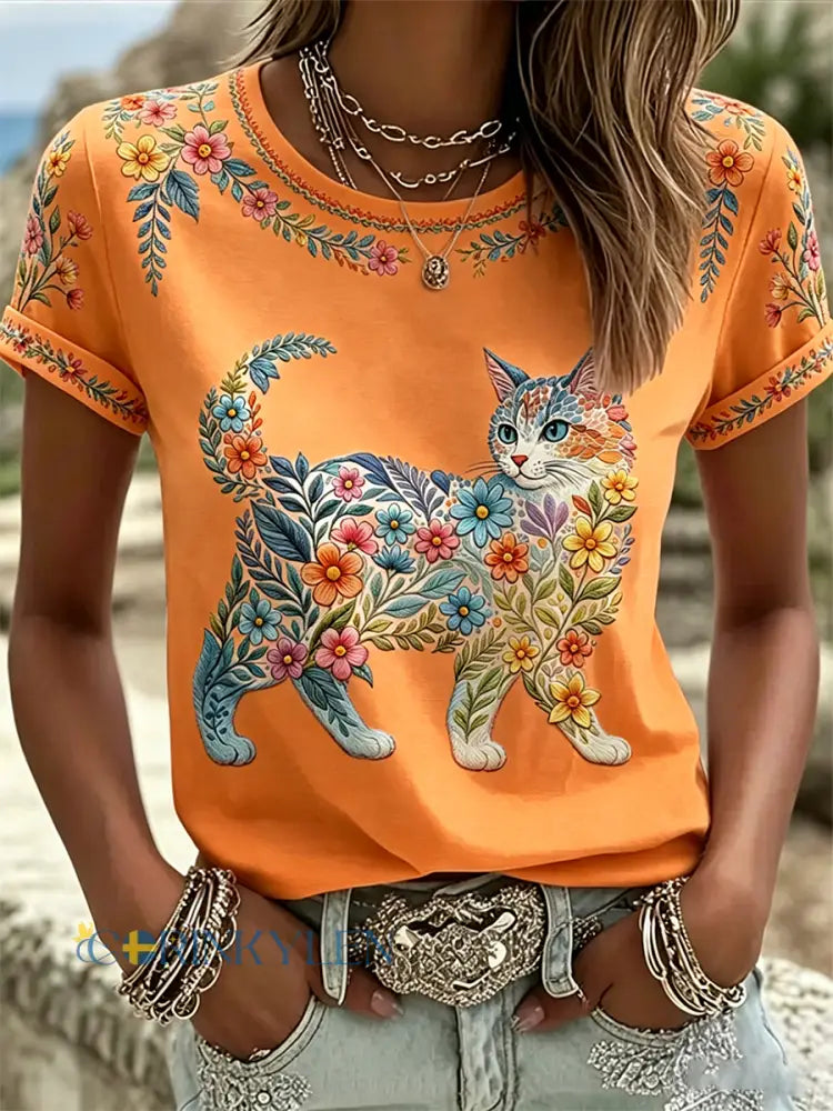 Dams örtblommig kattmönstrad casual t-shirt - oräng / S