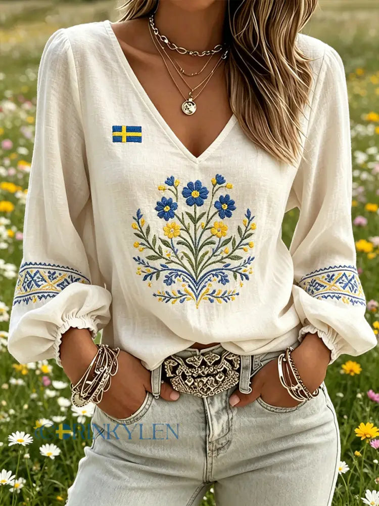 Dams topp med midsommarmotiv blommönstrad v-ringning och puffärmar - A / S