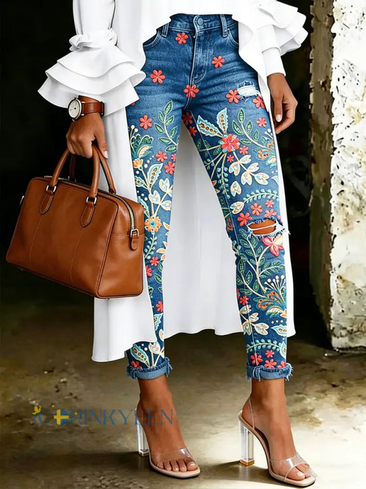 Damsjeans med artistisk blommönster - blå / S