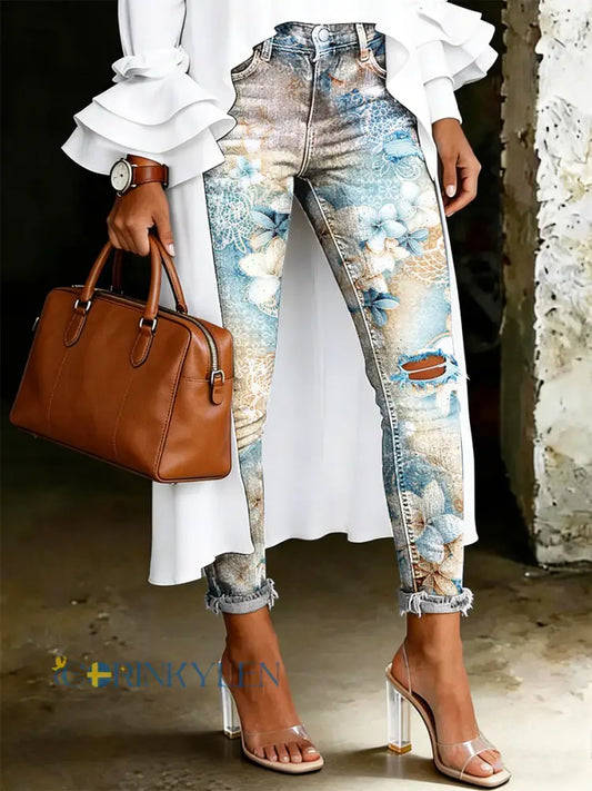 Damsjeans med artistisk blommönster - ljusblåa / S