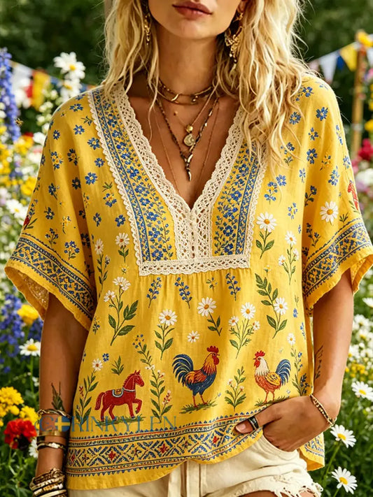 Damskjorta i ledig stil med V-ringning och midsommartryck - A / S