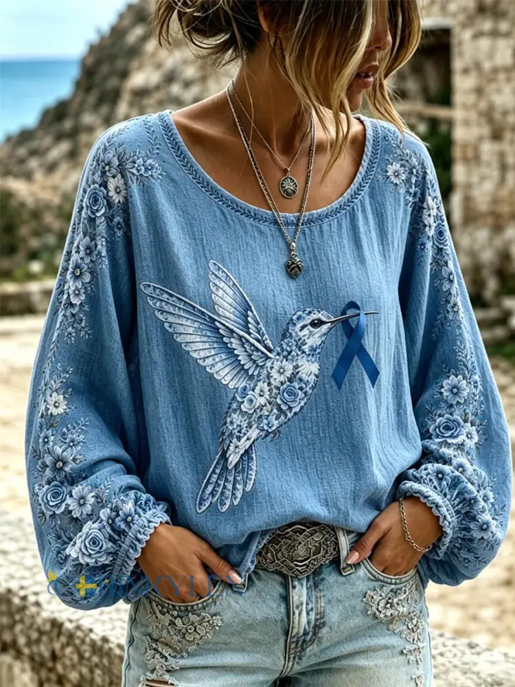Kvinnors lila blommor & Hummingbird Skriv ut Alzheimers medvetenhet Stöd Långa ärmar Topp - blå / S